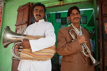 India, Rajasthan, Pushkar, Portrait of a tuba and trumpet players.