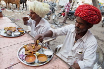 India, Rajasthan, Kekri, Men eating thali.