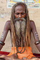 India, Uttar Pradesh, Varanasi, Portrait of a saddhu on the ghats at Varanasi.