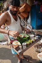 India, Bengal, Kolkata, Pan Vendor in Malik Ghat Flower Market, Kolkata.