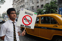 India, Bengal, Kolkata, Schoolboy protesting about noise pollution in Kolkata.
