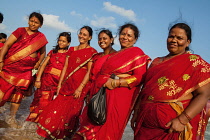India, Tamil Nadu, Mahabalipuram, A group of pilgrims on the beach at Mahabalipuram.