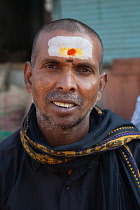 India, Telengana, Secunderabad, Portrait of a man with a tilak mark on the forehead, worn for spiritual reasons.