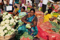 India, Telengana, Secunderabad, Cauliflower vendor at the vegetable market in Secunderabad.