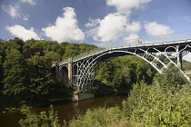 England, Shropshire, Ironbridge, View of the grade 1 listed Cast Iron Bridge across the river Severn.