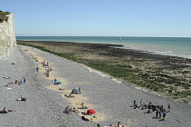 England, East Sussex, Birling Gap, View along pebble beach with the Seven Sisters white chalk cliffs.