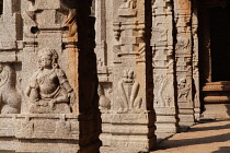 India, Karnataka, Hampi, Carvings on the columns of the Achyutaraya temple in Hampi.