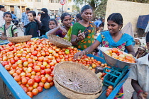India, Karnataka, Hospet, Tomato vendor in the market at Hospet.