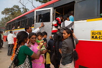India, Karnataka, Hassan, Passengers boarding a bus in Hassan.