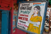 India, Karnataka, Mysore, Sign for a medical practitioner in Mysore.