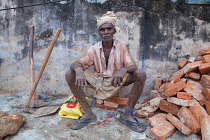 India, Kerala, Anjengo, Portrait of a road labourer.