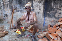 India, Kerala, Anjengo, Portrait of a road labourer.