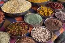 India, Karnataka, Bijapur, Display of lentils, spices and pulses in the market at Bijapur.