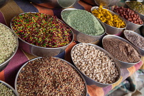 India, Karnataka, Bijapur, Display of lentils, spices and pulses in the market at Bijapur.