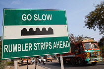 India, Karnataka, Bijapur, Speedbreaker sign on the outskirts of Bijapur.