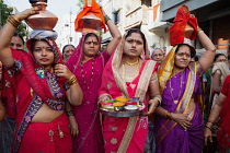 India, Maharashtra, Dhule, A group of women celebrate a local festival in the streets of Dhule.