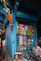 India, Maharashtra, Dhule, Vendor selling pan, cigarettes & beedis from his stall in Dhule.