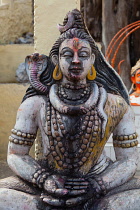 India, Madhya Pradesh, Omkareshwar, Stone statue of Shiva at Omkareshwar.