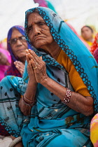 India, Madhya Pradesh, Omkareshwar, A female pilgrim at a prayer in Omkareshwar.