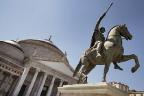 Italy, Campania, Naples, Equestrian statue and San Francesco Di Paola Church in Piazza Del Plebiscito.