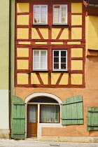 Germany, Bavaria, Rothenburg ob der Tauber, Facade of a colourful half timbered house.