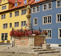 Germany, Bavaria, Rothenburg ob der Tauber, Seelbrunnen Fountain with statue of Minerva.