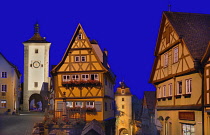 Germany, Bavaria, Rothenburg ob der Tauber, Plonlein or Little Square by night flanked by the Siebers Tower and the Kobolzeller tower.