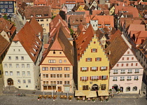 Germany, Bavaria, Rothenburg ob der Tauber, Colourful buildings in Marktplatz seen from the top of the Town Hall tower.