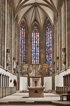 Germany, Bavaria, Wurzburg, Marienkapelle, Interior view with the altar and stained glass windows.