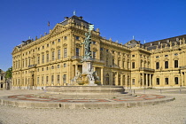 Germany, Bavaria, Wurzburg, Wurzburg Residenz or Residence Palace facade with the Franconia Fountain.