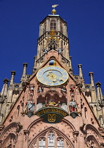 Germany, Bavaria, Nuremberg, Marktplatz, Facade of the 14th century Frauenkirche or Church of Our Lady, also visible is the  Männleinlaufen a mechanical clock that commemorates the Golden Bull of 1356.