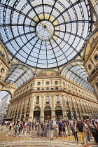 Italy, Lombardy, Milan. Galleria Vittorio Emanuele, View of the central area with the dome and tourists.