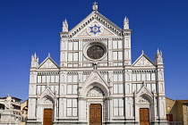 Italy, Tuscany, Florence, The 19th century marble facade of the 13th century Gothic church of Santa Croce containing the tombs of famous Florentines such as Michelangelo and Galilieo.