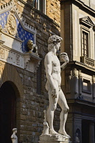 Italy, Tuscany, Florence, Piazza della Signoria, Replica of the famous David statue by Michelangelo with the Palazzo Vecchio as background.