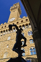 Italy, Tuscany, Florence, Piazza della Signoria, Palazzo Vecchio with the Perseus statue silhouetted.
