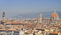 Italy, Tuscany, Florence, The bell tower and the dome of the Duomo with the tower of Palazzo Vecchio seen from Piazzale Michelangelo.