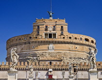 Italy, Rome, Castel Sant Angelo with statues on the Pont Sant Angelo in the foreground.