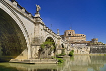 Italy, Rome, Castel Sant Angelo from along the banks of the River Tiber under the Pont Sant Angelo.