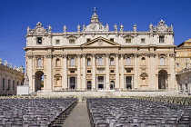 Italy, Vatican City, St Peters Square with the facade and dome of St Peters Basilica beyond.