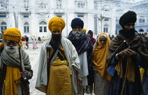 India, Bihar, Patna, Sikh pilgrims in temple courtyard.