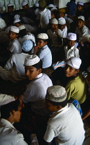 Sri Lanka, Negombo, Muslim boys gathered for prayers inside mosque.
