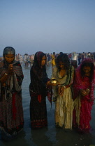India, West Bengal, Sagar Island, Women pilgrims at three day Sagar bathing festival at island in mouth of the Hooghly considered to be the point where the Ganges joins the sea.
