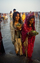 India, West Bengal, Sagar Island, Pilgrims with offerings at three day Sagar bathing festival at island in the mouth of the Hooghly considered to be the point where the Ganges joins the sea.