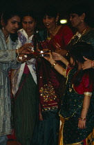 India, Religion, Hindu, Women and children at Diwali Festival celebrations.