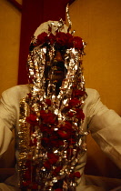 India, Uttar Pradesh, Agra, Portrait of bridegroom in wedding attire.