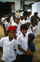 Sri Lanka, Negombo, Group of young Muslim boys outside mosque.