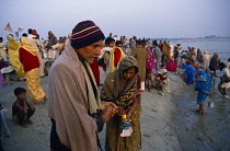 India, Uttar Pradesh, Allahabad, Magh Mela Festival pilgrims on the banks of the River Ganges.