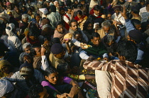 India, West Bengal, Sagar Island, Crowds of pilgrims with offerings at the temple to sage Kapil Muni on the island also known as Sagardwip.