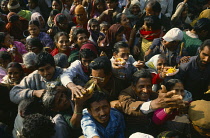 India, West Bengal, Sagar Island, Ganga Sagar, Crowd of pilgrims with offerings at temple to Sage Kapil Muni. Island is considered the point where the Ganges joins the sea.