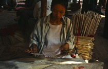Vietnam, South, General, Girl making incense sticks in village near Tay Ninh.